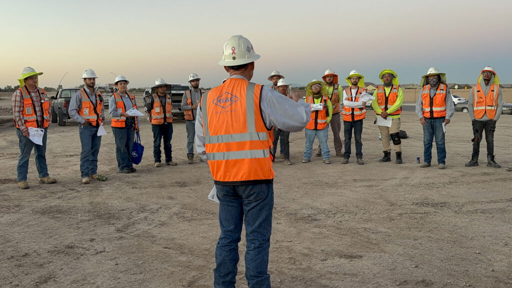 Group of construction workers meeting for a safety brief