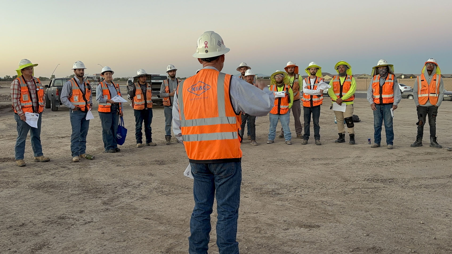 Group of construction workers meeting for a safety brief