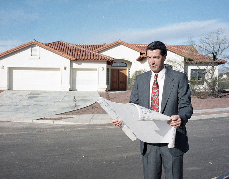 Karol George viewing site plans for a home in Sierra Vista