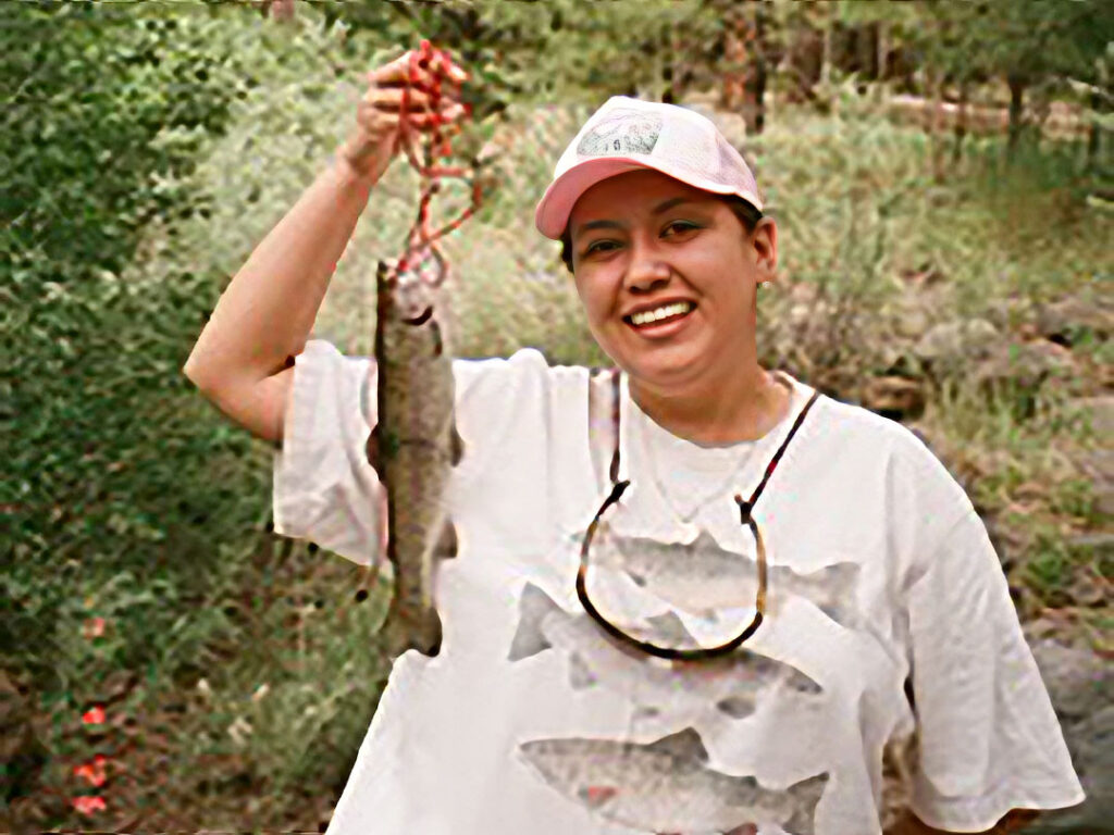 Lilian holding a fish