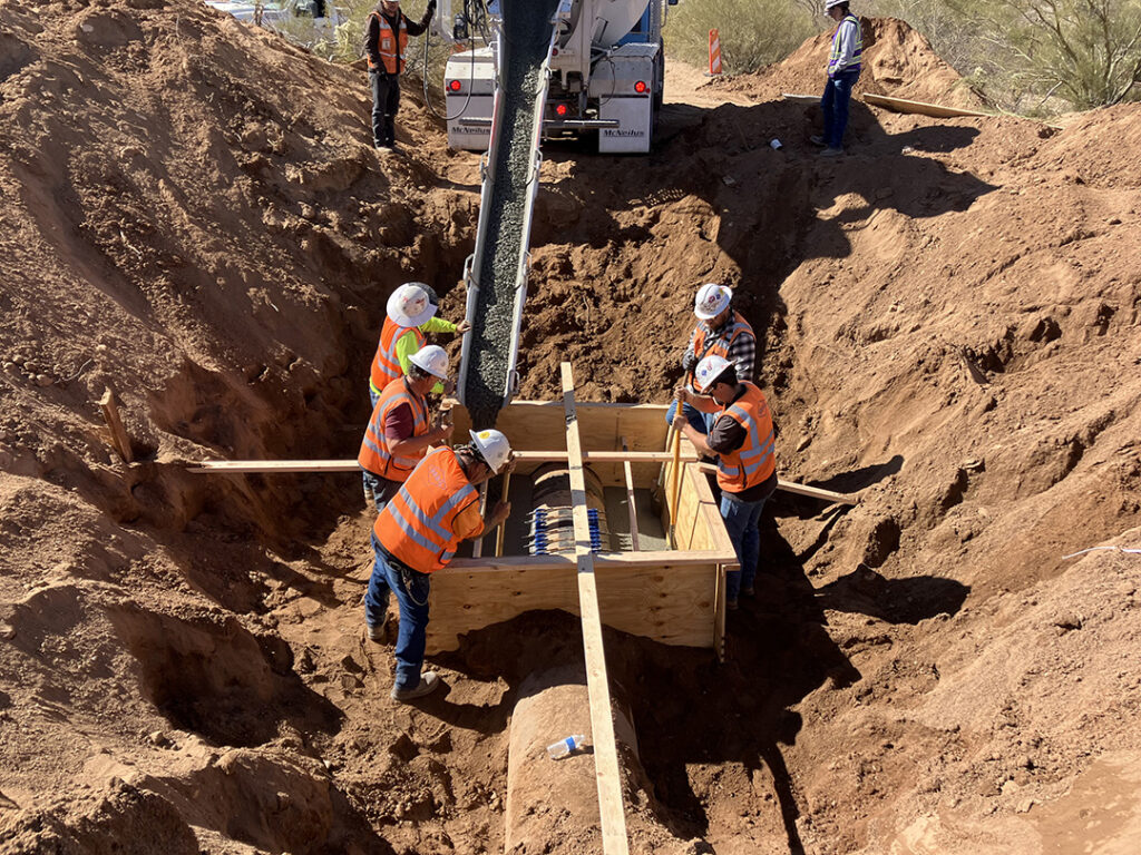 construction workers installing structured concrete at a mining site in Arizona