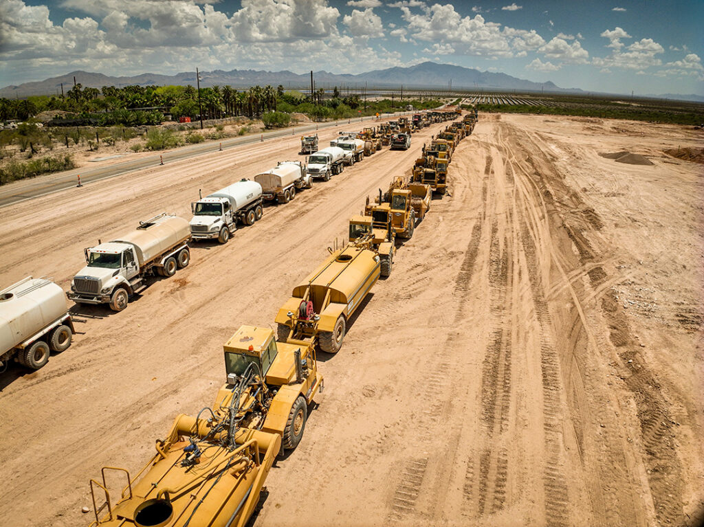 line up of heavy equipment on a jobsite